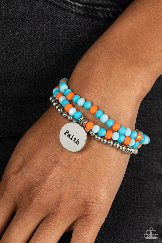 Fashionable Faith Multi Bracelet - Paparazzi Accessories  Embellished with silver and defaced beads in varying shades of blue and orange, three bracelets are threaded along elastic stretchy bands, for a fashionable stack across the wrist. Falling from one of the varying blue and orange bangles, a silver disc, with a hammered sheen, features the word "Faith," creating a simplistic collision of color and energy for a light-hearted finish.  Sold as one individual bracelet.