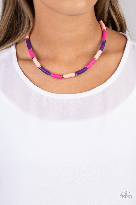 Rainbow Road Pink Necklace - Paparazzi Accessories  Rubber discs in shades of Pink Peacock, baby pink, and purple are threaded along an invisible wire, adorning the collar in a courageous pop of color. Shiny silver discs separate the bands of color, adding a hint of industrial sheen to the youthful design. Features an adjustable clasp closure.  Sold as one individual necklace. Includes one pair of matching earrings.