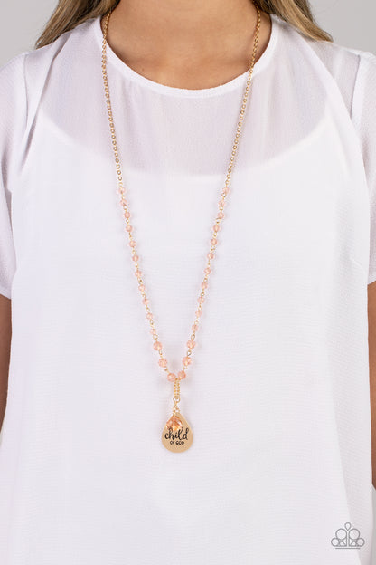 Divine Dance Gold Necklace - Paparazzi Accessories  Infused with faceted beads, featuring golden undertones, a classic gold chain holds up a textured curved gold ring. A hammered gold teardrop and glassy acrylic teardrop with golden undertones dangle below the curved ring for eye-catching movement. The phrase "child of God" is stamped across the hammered teardrop for a virtuous finish. Features an adjustable clasp closure.  Sold as one individual necklace. Includes one pair of matching earrings.