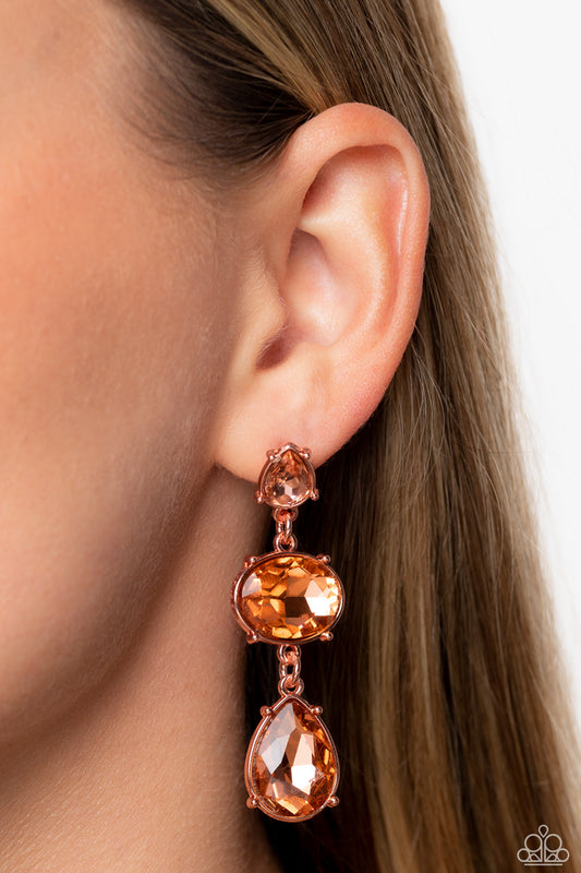 Royal Appeal Copper Post Earring - Paparazzi Accessories  A small, peachy, teardrop-shaped gem gives way to a peachy oval-shaped rhinestone tilted on its side. A large, peachy teardrop swings from the oval above, adding dramatic movement to the colorful display. Each faceted gem is set in pronged shiny copper fittings, exaggerating their sparkle as they swing from the ear in a lustrous finish.  Sold as one pair of post earrings.  P5PO-CPSH-054XX