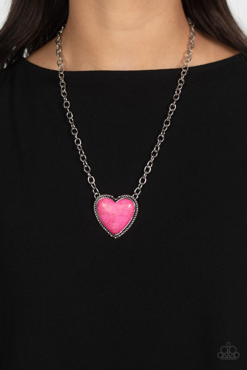 Authentic Admirer Pink Heart Necklace - Paparazzi Accessories  Dangling from the bottom of a thick silver chain, an oversized, hot pink stone is pressed into a textured, studded, silver heart frame for some southwestern sass. Features an adjustable clasp closure. As the stone elements in this piece are natural, some color variation is normal.  Sold as one individual necklace. Includes one pair of matching earrings.  P2SE-PKXX-244XX