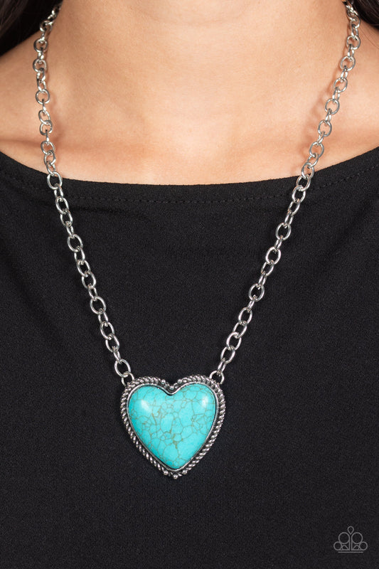 Authentic Admirer Blue Necklace - Paparazzi Accessories  Dangling from the bottom of a thick silver chain, an oversized, turquoise stone is pressed into a textured, studded, silver heart frame for some southwestern sass. Features an adjustable clasp closure. As the stone elements in this piece are natural, some color variation is normal.  Sold as one individual necklace. Includes one pair of matching earrings.  P2SE-BLXX-520XX