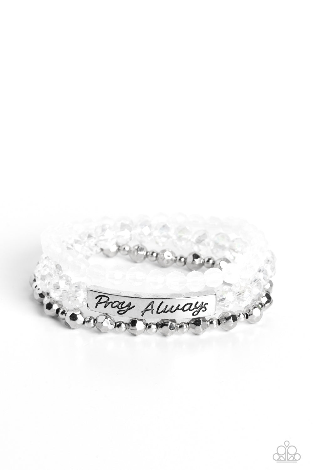 Pray Always White Bracelet - Paparazzi Accessories  Varying in shape and shimmer, faceted silver beads, milky white beads, and glittery crystal-like beads are threaded along elastic stretchy bands, creating colorful layers across the wrist. Featured on the crystal-like band, a curved silver bar features the words "Pray Always" in a curly, stamped font for a soft finish.  Sold as one individual bracelet.