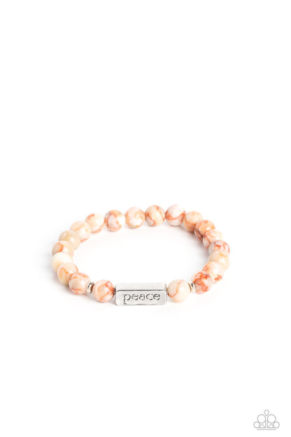 Serene Season Orange Stretch Bracelet - Paparazzi Accessories  Meeting at the center of an elastic stretch bracelet, a silver, rectangular bar, hammered in a light sheen, is stamped with the word "peace" for a serene statement. Marbled, orange stone beads, and silver accents encircle the silver bar creating a calming, cheerful finish. As the stone elements in this piece are natural, some color variation is normal.  Sold as one individual bracelet.