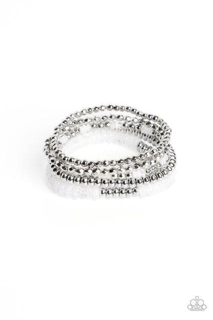 Pristine Pixie Dust White Bracelet - Paparazzi Accessories   Varying sizes and textures of silver beads combine with a collection of solid, milky, and cloudy white beads in varying sizes, to create a playful stack of bracelets that layer across elastic stretchy bands creating a youthful and energetic impression.  Sold as one set of five bracelets.