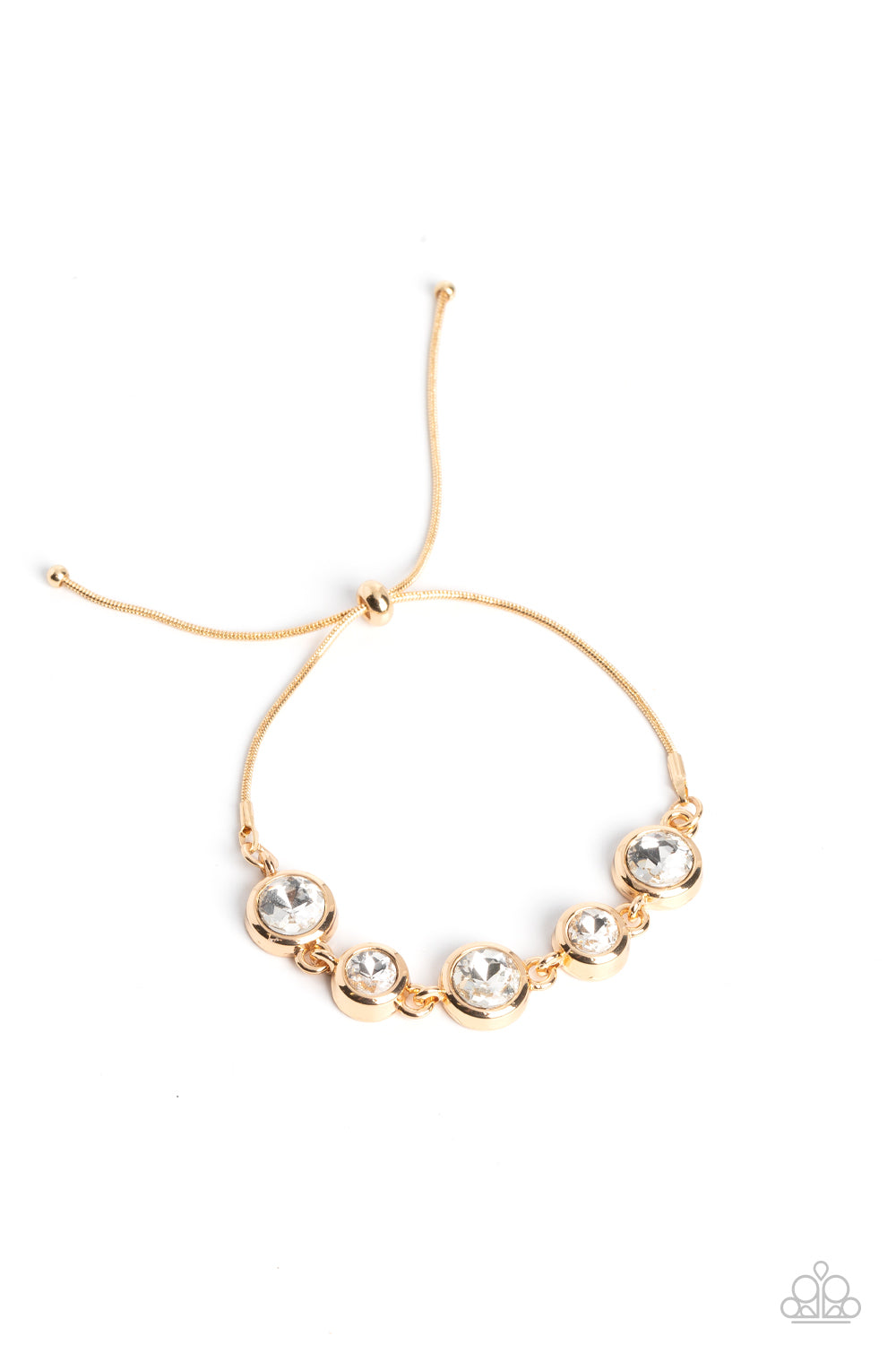 Classically Cultivated Gold Bracelet - Paparazzi Accessories  Varying sizes of classic, round, brilliant-cut white rhinestones set in thick, circular, gold frames link together around the wrist with glamorous glimmer. The rhinestones attach to a dainty strand of gold snake chain that wraps around the wrist in a refined finish. Features an adjustable lariat sliding bead closure.  Sold as one individual bracelet.