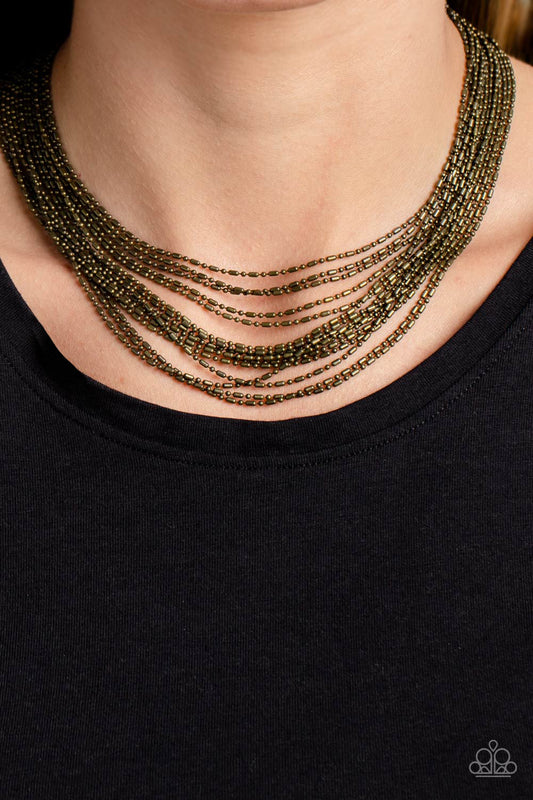 Cascading Chains Brass Necklace - Paparazzi Accessories  Suspended from two brass, horizontal bars, a shimmery cascade of brass ball-and-bar chains layer around the neck for an industrial statement. Features an adjustable clasp closure.  Sold as one individual necklace. Includes one pair of matching earrings.  P2ST-BRXX-110XX
