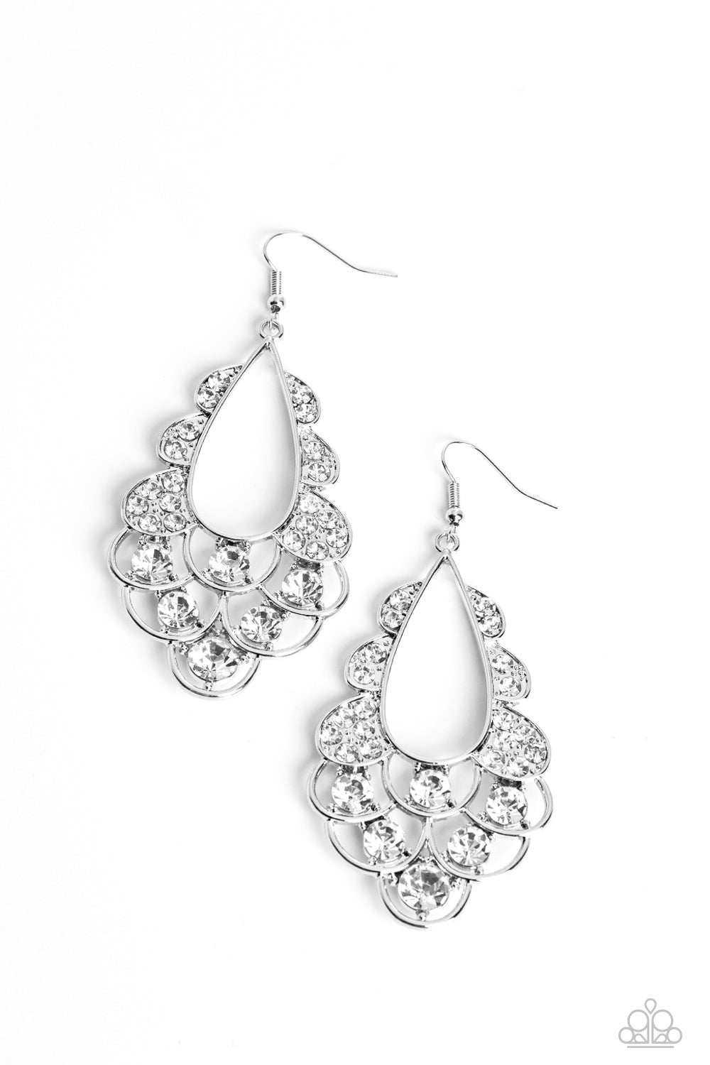 Majestic Masquerade White Earring - Paparazzi Accessories  Airy loops of high-sheen silver, dotted with glittery white faceted gems, ripple out from an airy teardrop shape. Some curls feature solitaire oversized gems, while others feature a dainty collection resulting in a timeless, incandescent teardrop chandelier below the ear. Earring attaches to a standard fishhook fitting.  Sold as one pair of earrings.