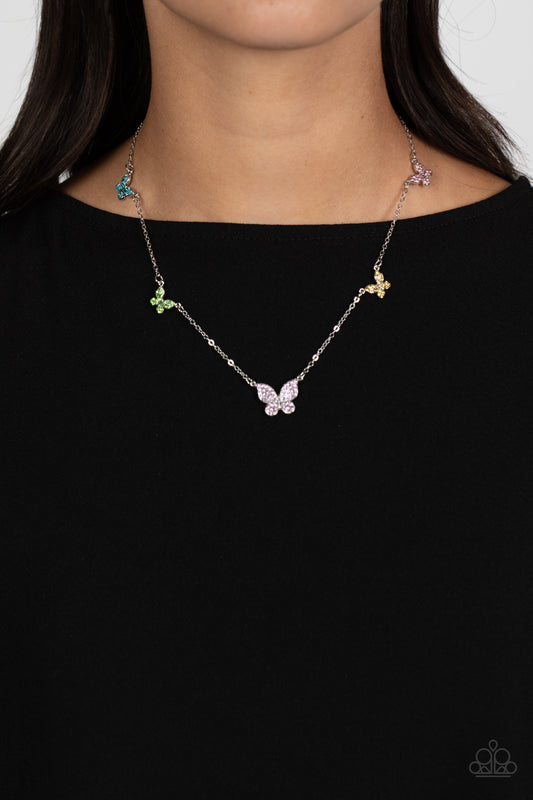 FAIRY Special Multi Butterfly Necklace - Paparazzi Accessories  Floating along a dainty silver chain, a collection of silver butterflies in varying sizes coalesces around the neckline for a whimsical finish. Each butterfly features a monochromatic shimmer of pink, yellow, purple, green, and blue rhinestones for a sparkly statement. Features an adjustable clasp closure.  Sold as one individual necklace. Includes one pair of matching earrings.  P2DA-MTXX-094XX