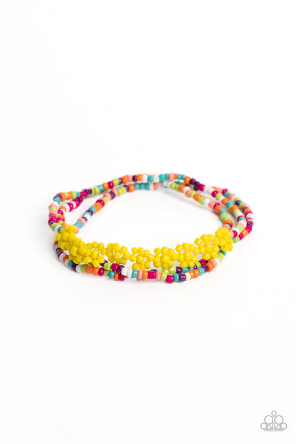 Buzzworthy Botanicals Multi Bracelet - Paparazzi Accessories  Strung along the entirety of three elastic stretchy bands, multicolored seed beads, in shades of pink, purple, blue, orange, white, and green coalesce around the wrist. Featured on one of the multicolored bands, blooming yellow seed bead flowers, with yellow seed bead centers haphazardly interrupt the refreshing collection for a carefree, charismatic finish.  Sold as one individual bracelet.  P9DA-MTXX-050XX