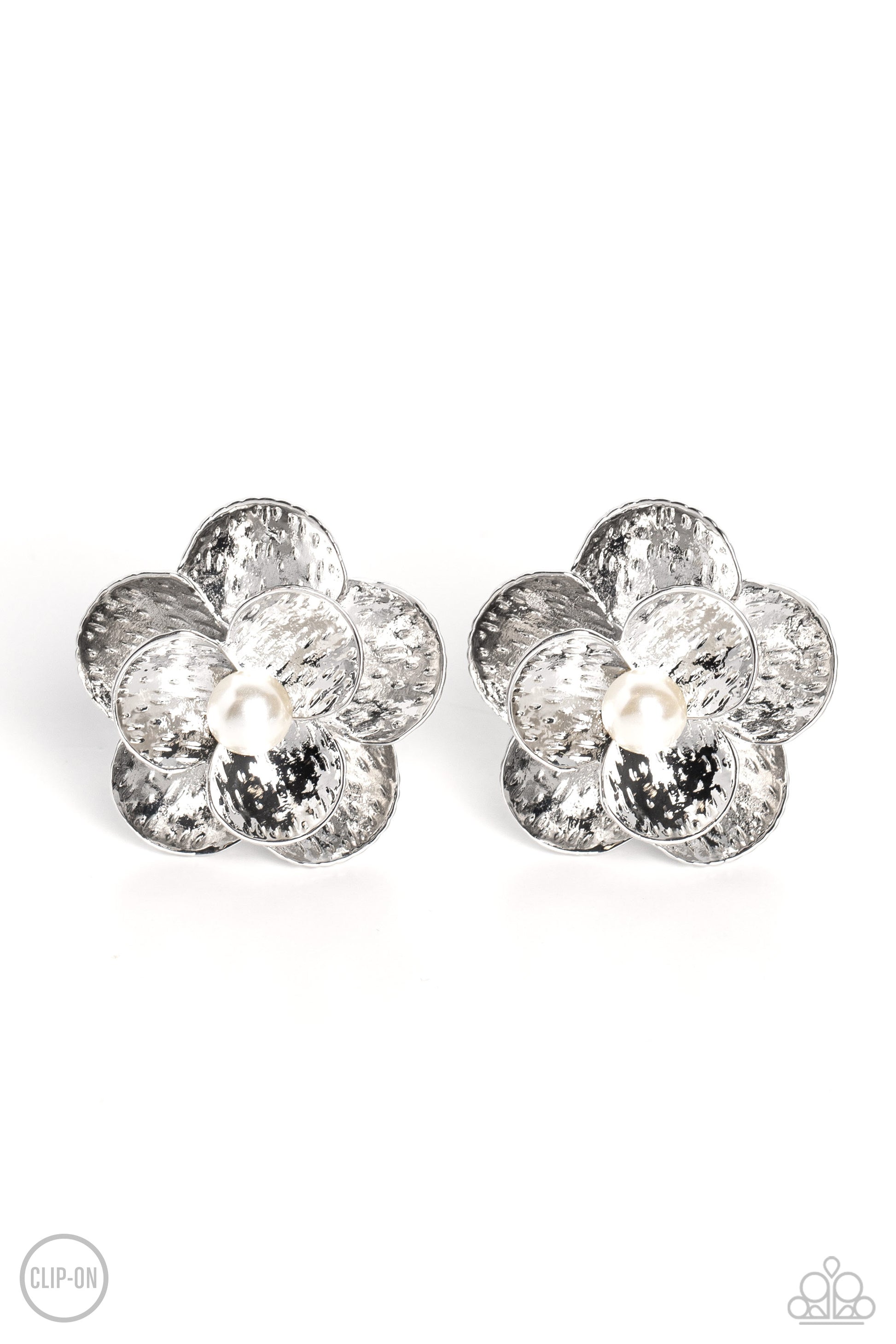 Miami Magic White Clip-On Earring - Paparazzi Accessories  Flaring out from a white pearl center, silver flowers, featuring studded petals, grace the ear. An oversized silver flower, featuring the same studded design as the smaller flower, creates the 3D design and draws additional attention to the whimsical design. Earring attaches to a standard clip-on fitting.  Sold as one pair of clip-on earrings.  P5CO-WTXX-141XX