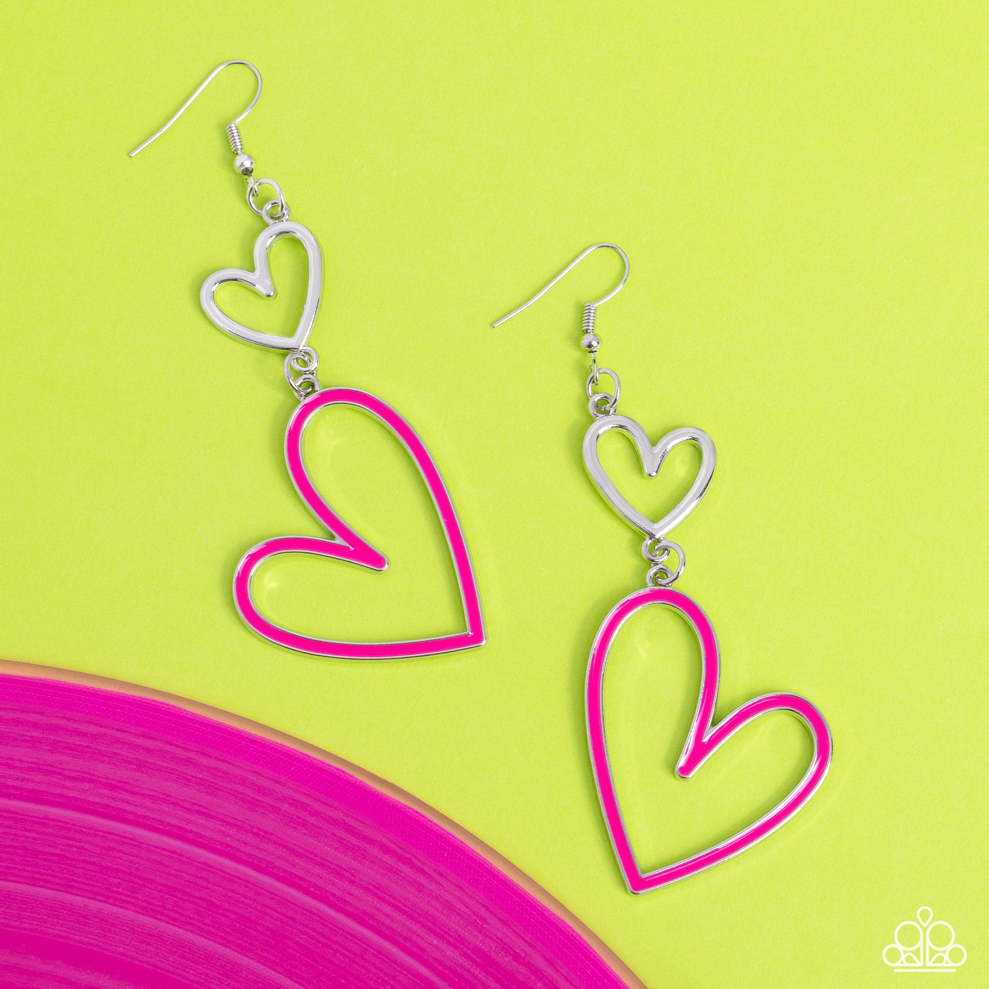 Pristine Pizzazz Pink Heart Earring - Paparazzi Accessories  Dangling from an abstract silver heart frame, another heart frame, this time an oversized one, features a border of Pink Peacock paint, creating an attention-grabbing romantic statement below the ear. Earring attaches to a standard fishhook fitting.  Sold as one pair of earrings.  P5WH-PKXX-275XX