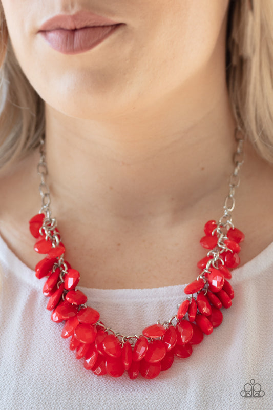 Colorfully Clustered - Red Item #N468 A fiery red collection of polished and crystal-like teardrop beads cluster along the bottom of a shimmery silver chain, creating a flirtatious fringe below the collar. Features an adjustable clasp closure. All Paparazzi Accessories are lead free and nickel free!  Sold as one individual necklace. Includes one pair of matching earrings.