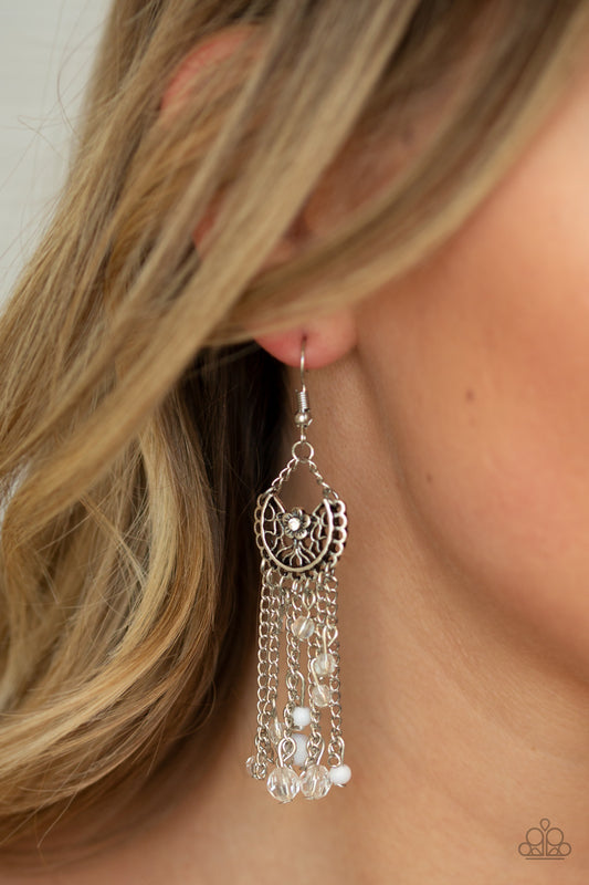 Daisy Daydream - White Item #E242 Dotted with a solitaire white rhinestone, a shimmery silver floral frame gives way to an array of white beaded tassels for a whimsical flair. Earring attaches to a standard fishhook fitting. All Paparazzi Accessories are lead free and nickel free!  Sold as one pair of earrings.