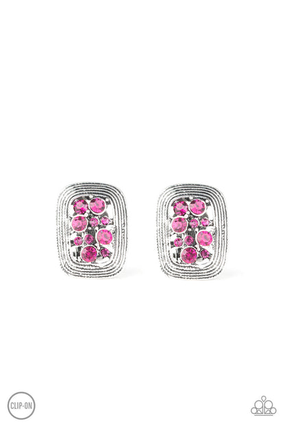 Darling Dazzle - Pink Item #E351 Sparkling pink rhinestones collected inside a border of silver, creating a refined frame. Earring attaches to a standard clip-on earring. All Paparazzi Accessories are lead free and nickel free!  Sold as one pair of clip-on earrings.