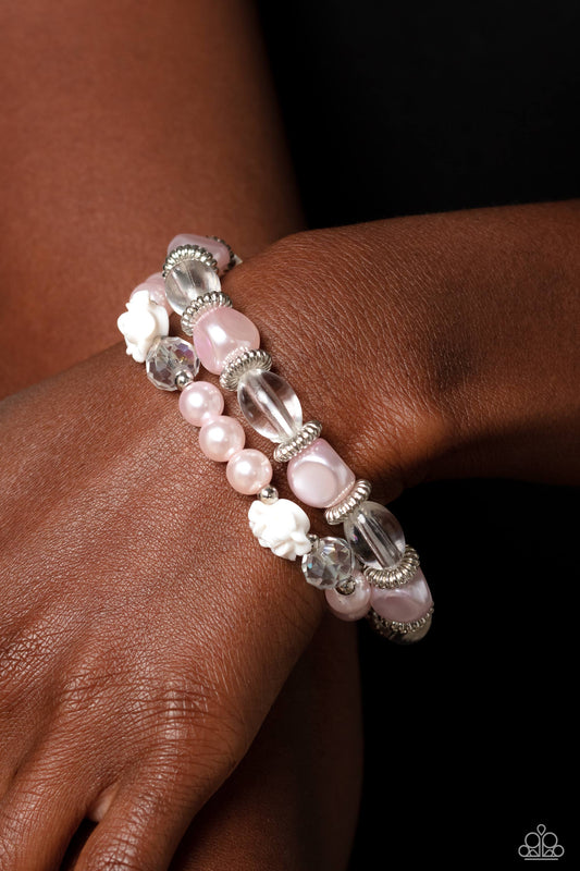 Who ROSE There? Pink Pearl Bracelet - Paparazzi Accessories  Baby pink pearls, silver studded rings, varying shapes of baby pink and clear beads, silver accents, faceted clear beads, and white resin roses stretch across elastic stretchy bands around the wrist for a refined, floral display.  Sold as one set of two bracelets.  P9RE-PKXX-304XX