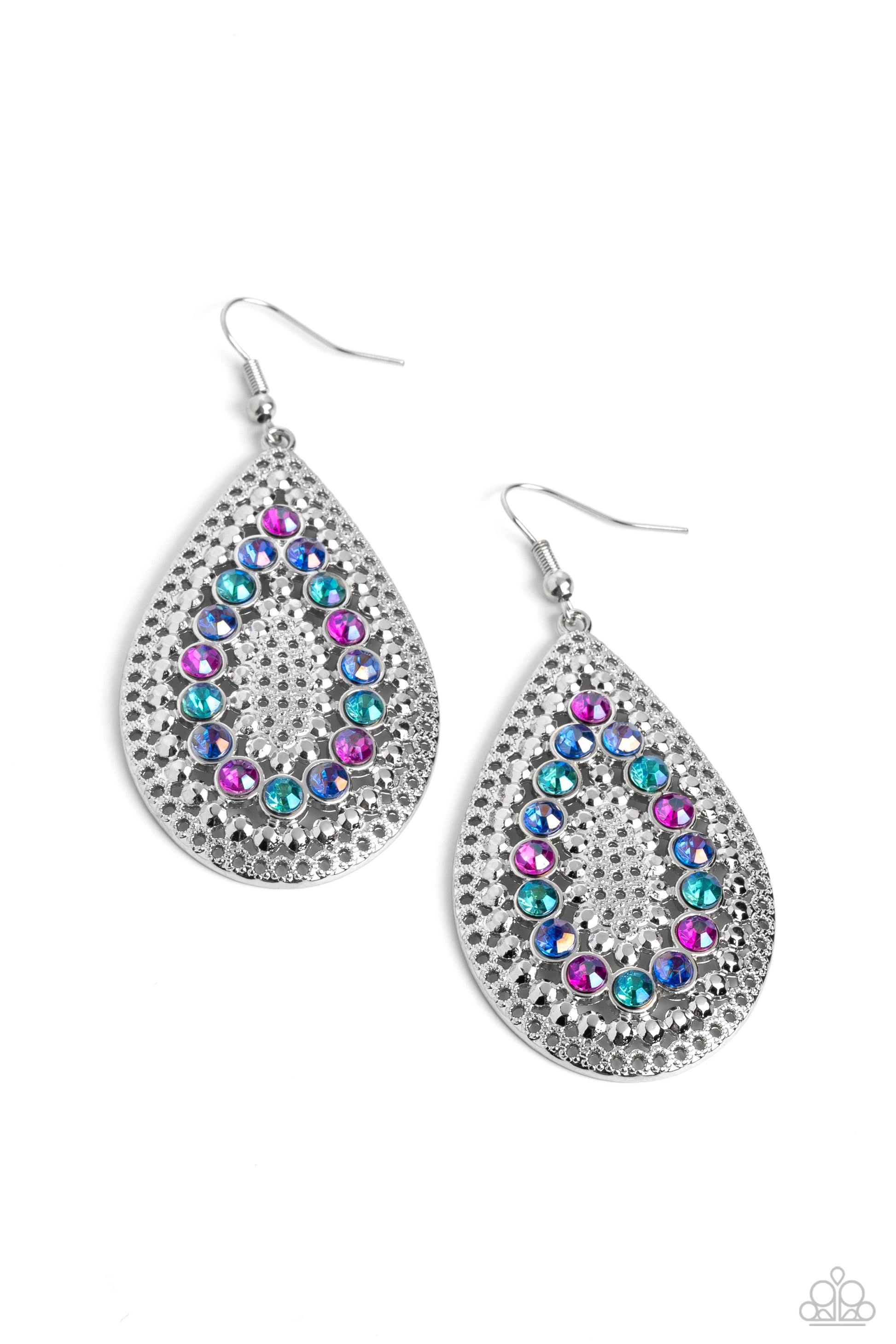 Spirited Socialite Multi Earring - Paparazzi Accessories  Set against an airy, dot motif backdrop, faceted purple and various shades of blue rhinestones curve into a teardrop shape atop an oversized silver teardrop lure, creating a dazzling pop of color near the ear. Earring attaches to a standard fishhook fitting.  Sold as one pair of earrings.  P5RE-MTXX-126XX