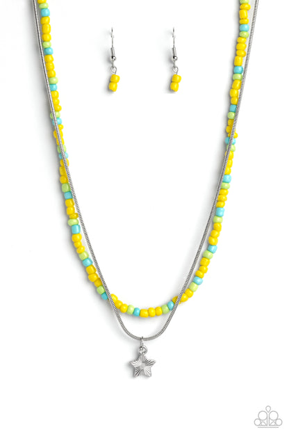 Starry Serendipity Yellow Necklace - Paparazzi Accessories  Multicolored seed beads in shades of yellow, blue, and green are threaded along a wire, falling along the collar in a capricious pattern. A delicate silver snake chain, features a twinkling silver star etched with linear textures, as it layers together with the colorful beads for a sassy and starry, combo. Features an adjustable clasp closure.  Sold as one individual necklace. Includes one pair of matching earrings.  P2DA-YWXX-074XX