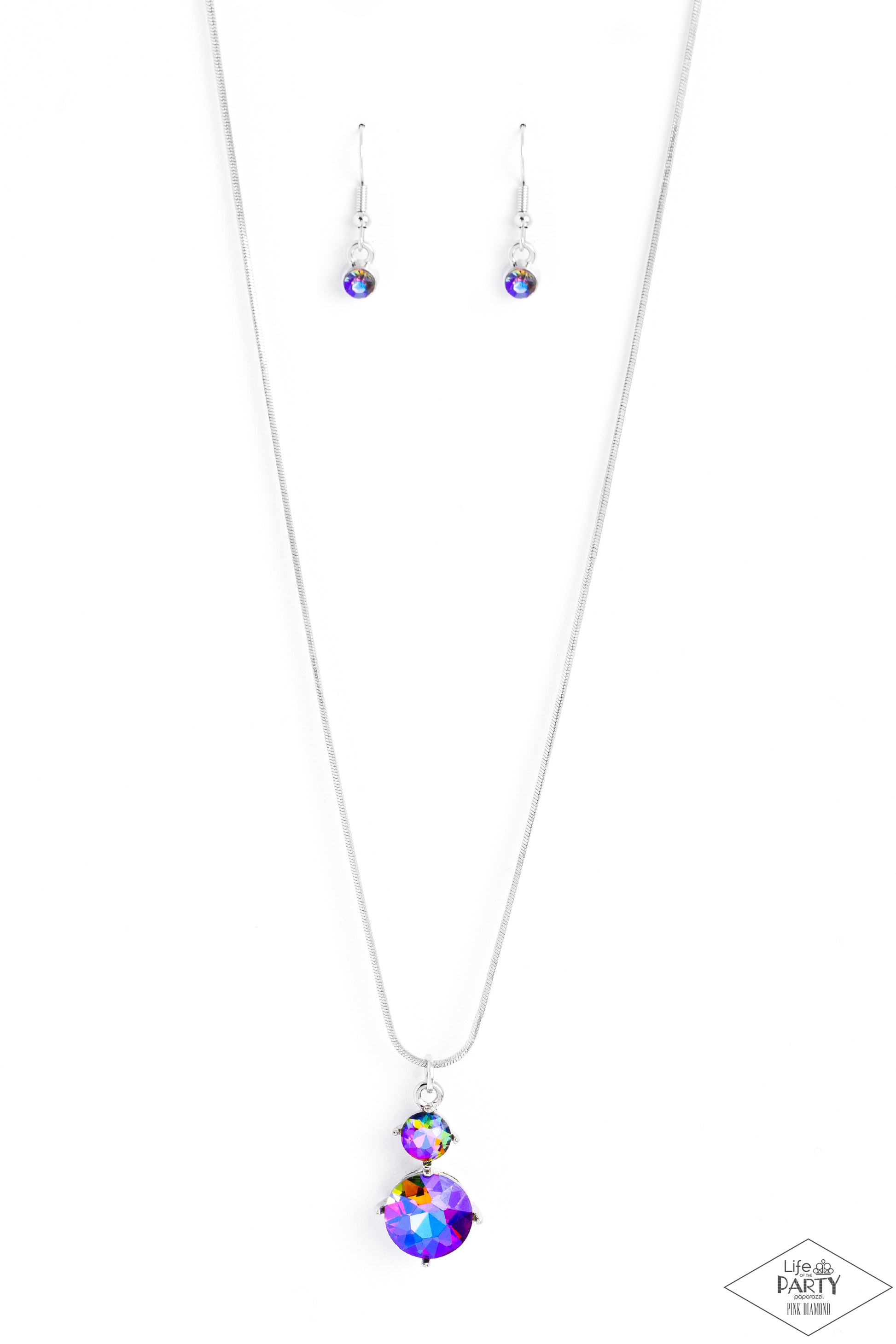 Top Dollar Diva Multi Necklace - Paparazzi Accessories  Nestled inside classic silver prongs, two oversized rhinestones, featuring a UV shimmer, slide along a dainty silver snake chain, creating a dramatic pendant below the collar. Features an adjustable clasp closure.  Sold as one individual necklace. Includes one pair of matching earrings.  P2RE-MTXX-222XX  New KitENCORE This Pink Diamond Encore is back in the spotlight at the request of our 2023 Life of the Party member with Pink Diamond Access, Mandi W.