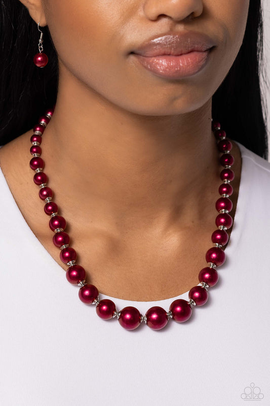 Manhattan Mogul Red Pearl Necklace - Paparazzi Accessories  A single strand of rich red pearls elegantly cascades below the collar, creating a glamorous graceful effect. Features an adjustable clasp closure.  Sold as one individual necklace. Includes one pair of matching earrings.  P2RE-RDXX-251XX