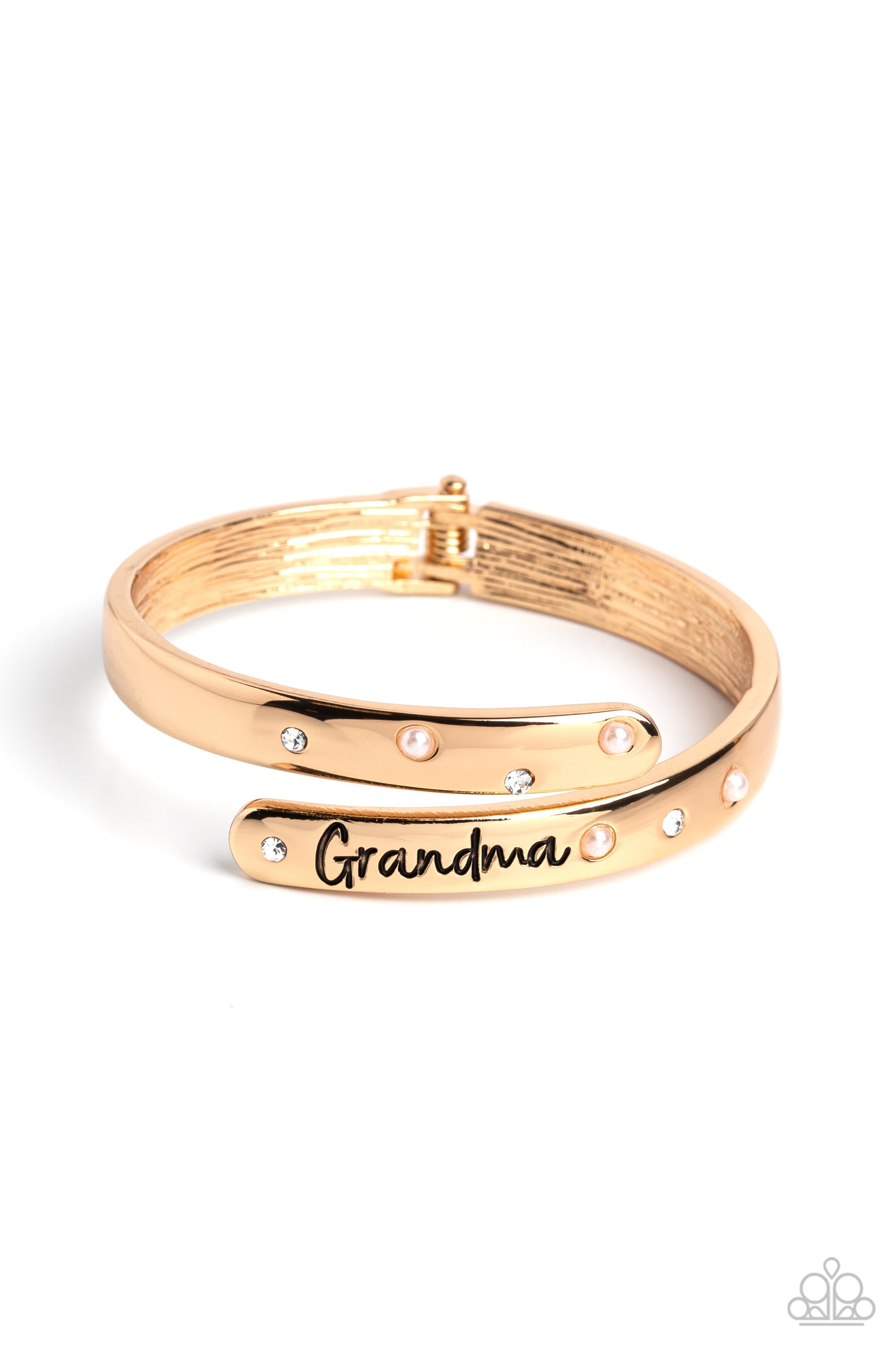 Gorgeous Grandma Gold Hinge Bracelet - Paparazzi Accessories  High-sheen gold curves into a hinged closure around the wrist. Featured on the upper curve, dainty pearls and white rhinestones alternate in a zig-zag pattern for a refined shimmer. The lower curve of gold features the stamped word "Grandma" in a curly font with rhinestones and pearls bordering the word for additional elegance. Features a hinged closure.  Sold as one individual bracelet.  P9WD-GDXX-191XX