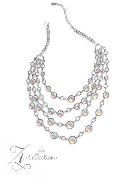 Hypnotic Multi 2023 Zi Collection Necklace - Paparazzi Accessories  A dizzying display of silver hoops drapes across the chest in effervescent layers. Smooth, glassy beads, brushed in swirls of pastel iridescence, bubble up from some of the open, circular frames, further exaggerating their staggered size and placement, and showcasing their dreamy opalescent finish. With every new angle, a different hue emerges from the glassy beads.