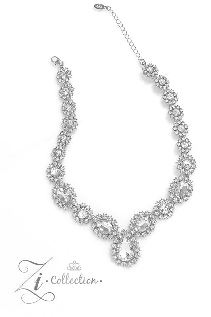 Everlasting White Rhinestone 2023 Zi Collection Necklace - Paparazzi Accessories  Brilliant white rhinestones, in both round and oval cuts, link around the neck in a stunning display. Each dramatically faceted gem is encircled by tiny white rhinestones set in pronged fittings, bringing a vintage charisma to the design. The floral-inspired frames gradually increase in size as they lead towards the center, where a teardrop-shaped gem drips into the spotlight. Features an adjustable clasp closure.