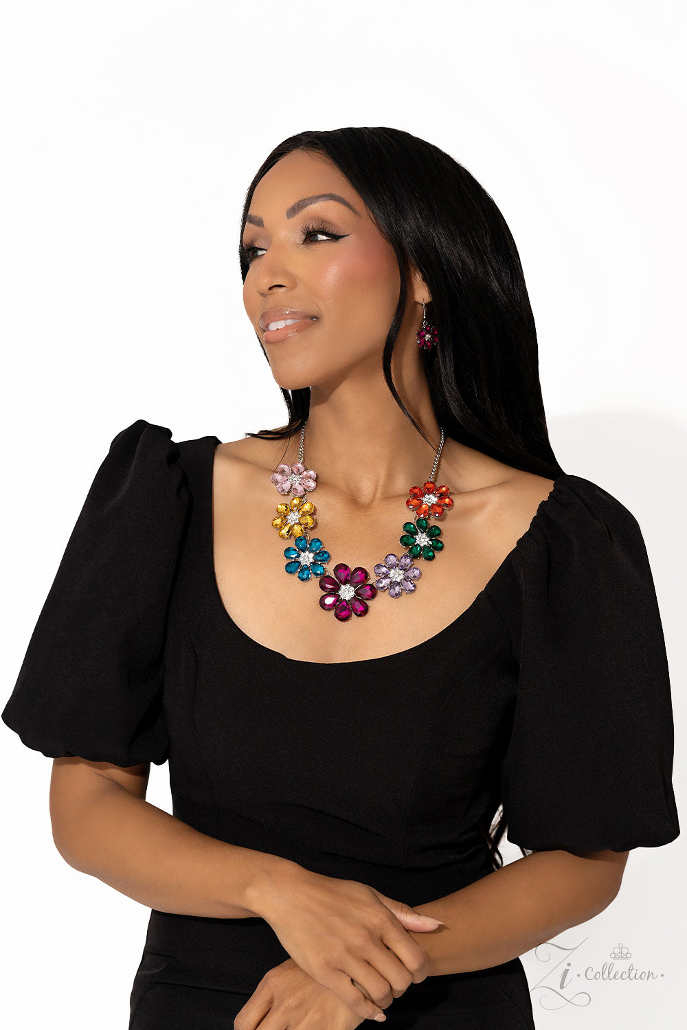Outgoing Multi Flower 2023 Zi Collection Necklace - Paparazzi Accessories  Colorful teardrop-shaped petals fan out around clusters of corrugated sparkle, blossoming into an enchanted kaleidoscope. The faceted surfaces of each petal add texture and depth, allowing the floral frames to pop with 3D detail and further highlight the spectrum of color at play. Features an adjustable clasp closure.
