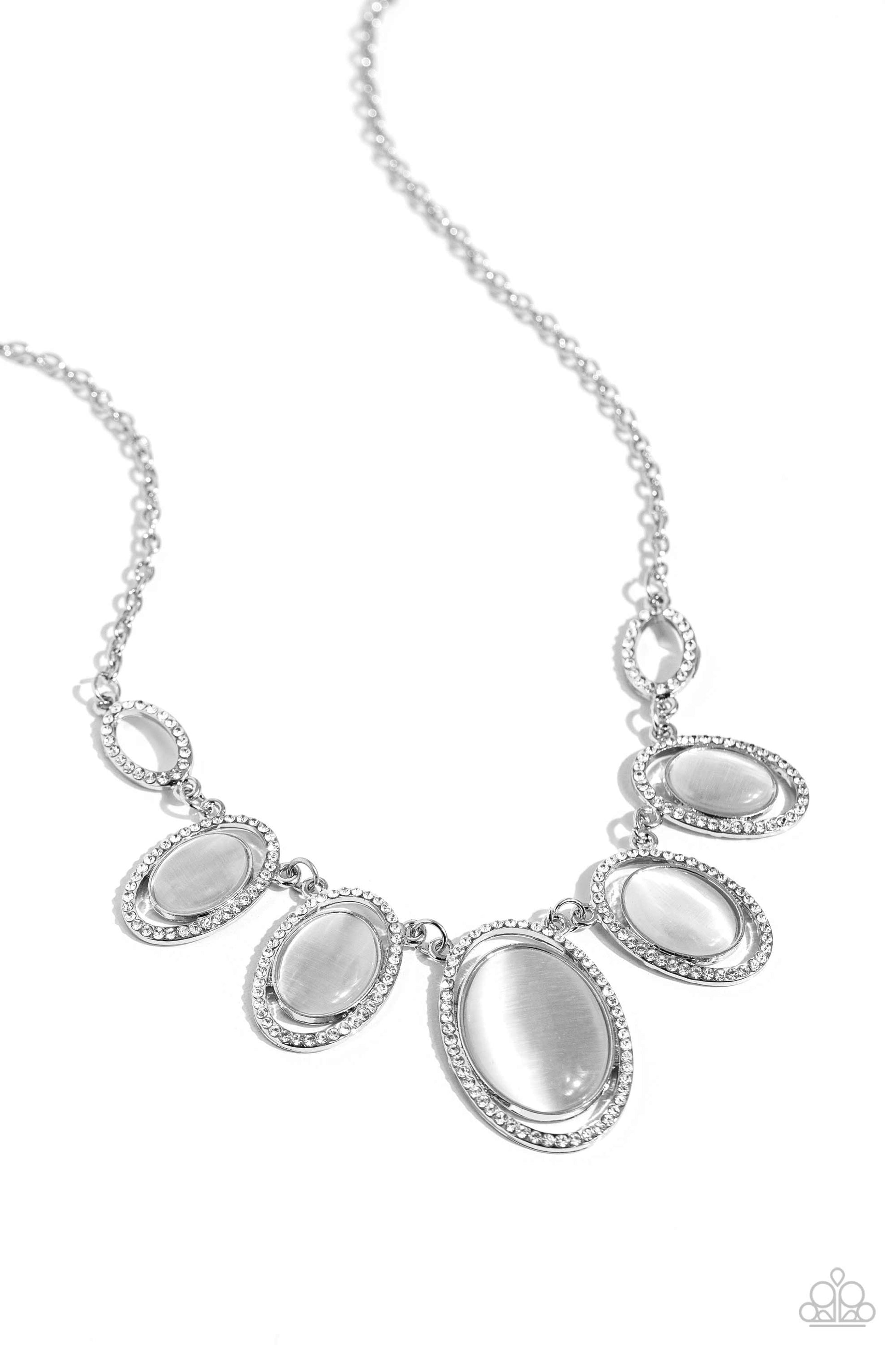 A BEAM Come True White Cat's Eye Stone Necklace - Paparazzi Accessories  Featuring white rhinestone encrusted oval frames, a mesmerizing collection of glowing white cat's eye stones delicately link below the collar for an ethereal pop of color. Features an adjustable clasp closure.  Sold as one individual necklace. Includes one pair of matching earrings.  P2RE-WTXX-650XX