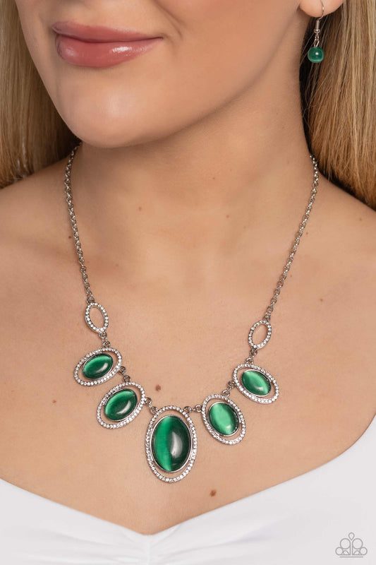 A BEAM Come True Green Necklace - Paparazzi Accessories  Featuring white rhinestone encrusted oval frames, a mesmerizing collection of glowing green cat's eye stones delicately link below the collar for an ethereal pop of color. Features an adjustable clasp closure.  Sold as one individual necklace. Includes one pair of matching earrings.  P2RE-GRXX-281XX