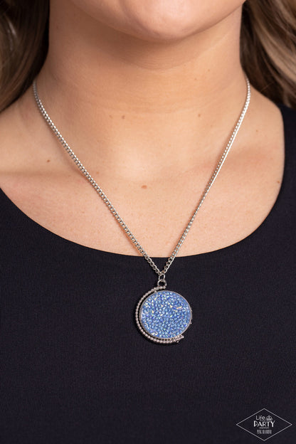 My Moon and Stars Multi Necklace - Paparazzi Accessories  A smoldering collision of blue iridescent and pink iridescent rhinestones are encrusted across the front and back of a textured silver disc below the collar. Threaded along a dainty rod, the glittery pendant effortlessly spins on its axis inside a silver studded half-circle frame. Features an adjustable clasp closure. Due to its prismatic palette, color may vary.