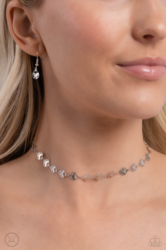 Fluttering Festival Silver Butterfly Choker Necklace - Paparazzi Accessories  Dainty silver butterfly charms, embedded in airy circles, are threaded around the collar creating a whimsical statement. Features an adjustable clasp closure.  Sold as one individual choker necklace. Includes one pair of matching earrings.  P2CH-SVXX-096XX