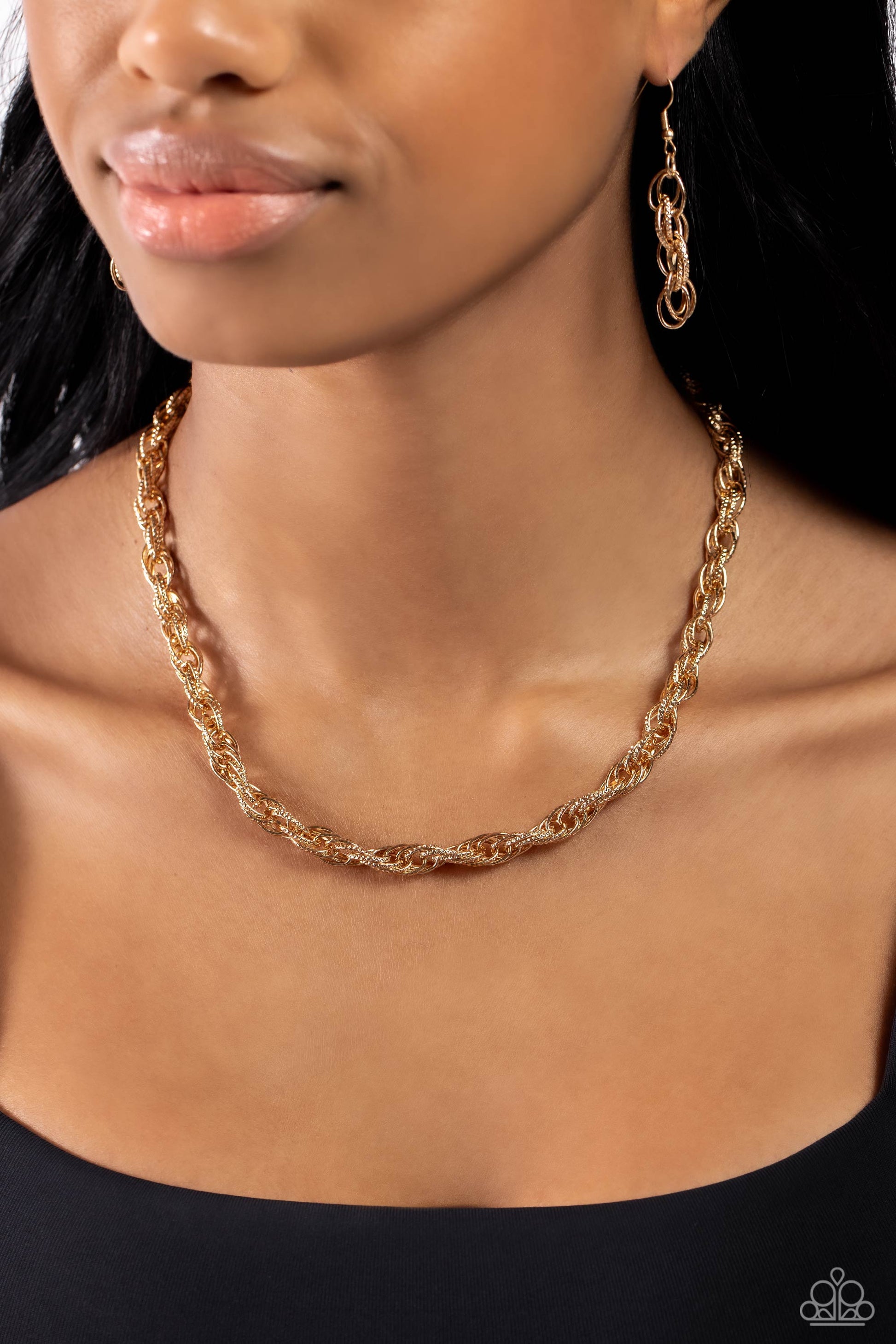 Braided Ballad Gold Rope Necklace - Paparazzi Accessories  Rings of gold, each embroidered in tactile texture weave into an interconnected braided centerpiece for a monochromatic chic look. Features an adjustable clasp closure.  Sold as one individual necklace. Includes one pair of matching earrings.  Sku:  P2ED-GDXX-159XX