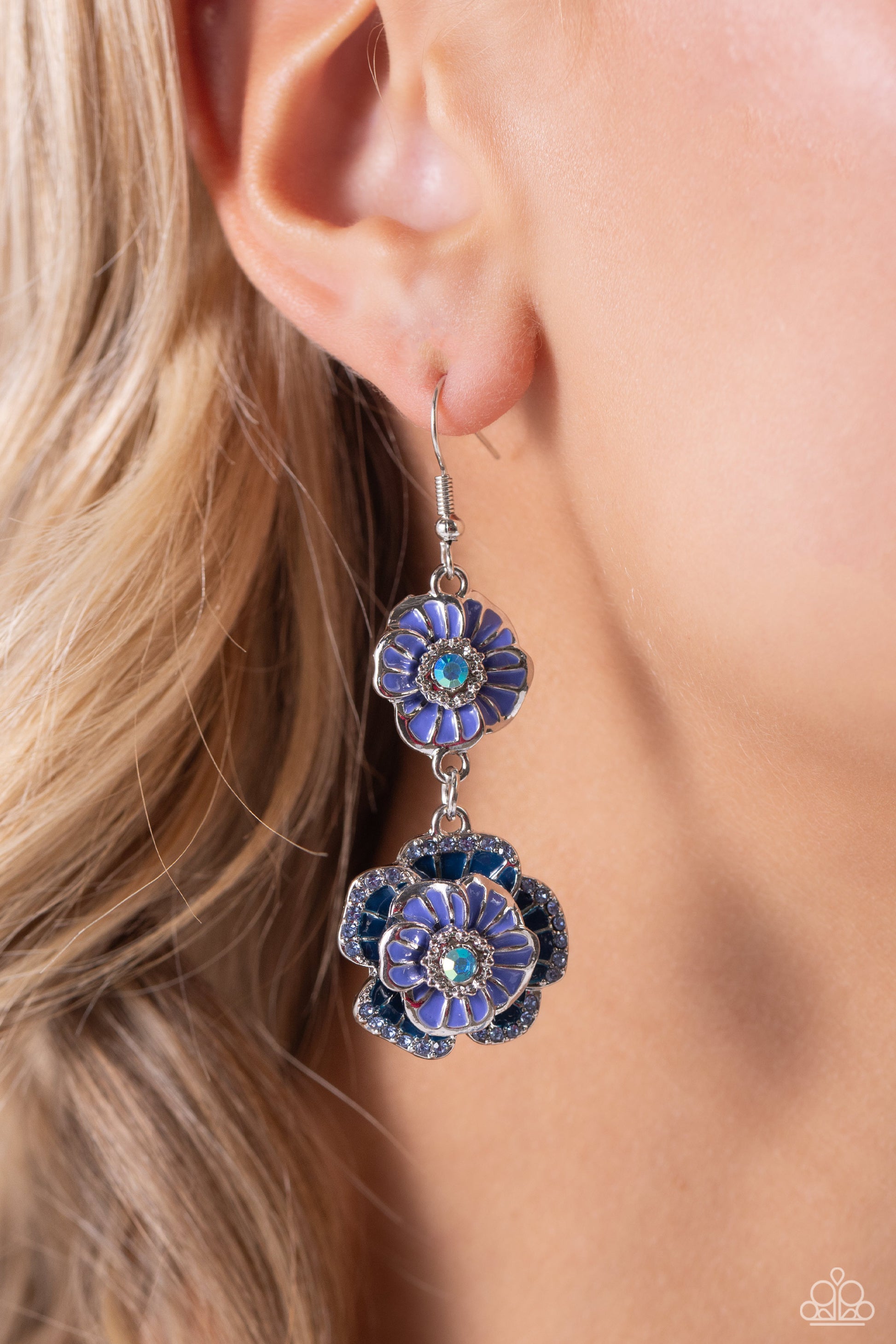 Intricate Impression Blue Flower Earring - Paparazzi Accessories  Dotted with dainty blue iridescent gem centers and navy rhinestone details, intricate 3D silver flowers, adorned in Persian Jewel shades, link into a whimsical, glitzy lure. Earring attaches to a standard fishhook fitting. Due to its prismatic palette, color may vary.  Sold as one pair of earrings.  Sku:  P5WH-BLXX-268XX