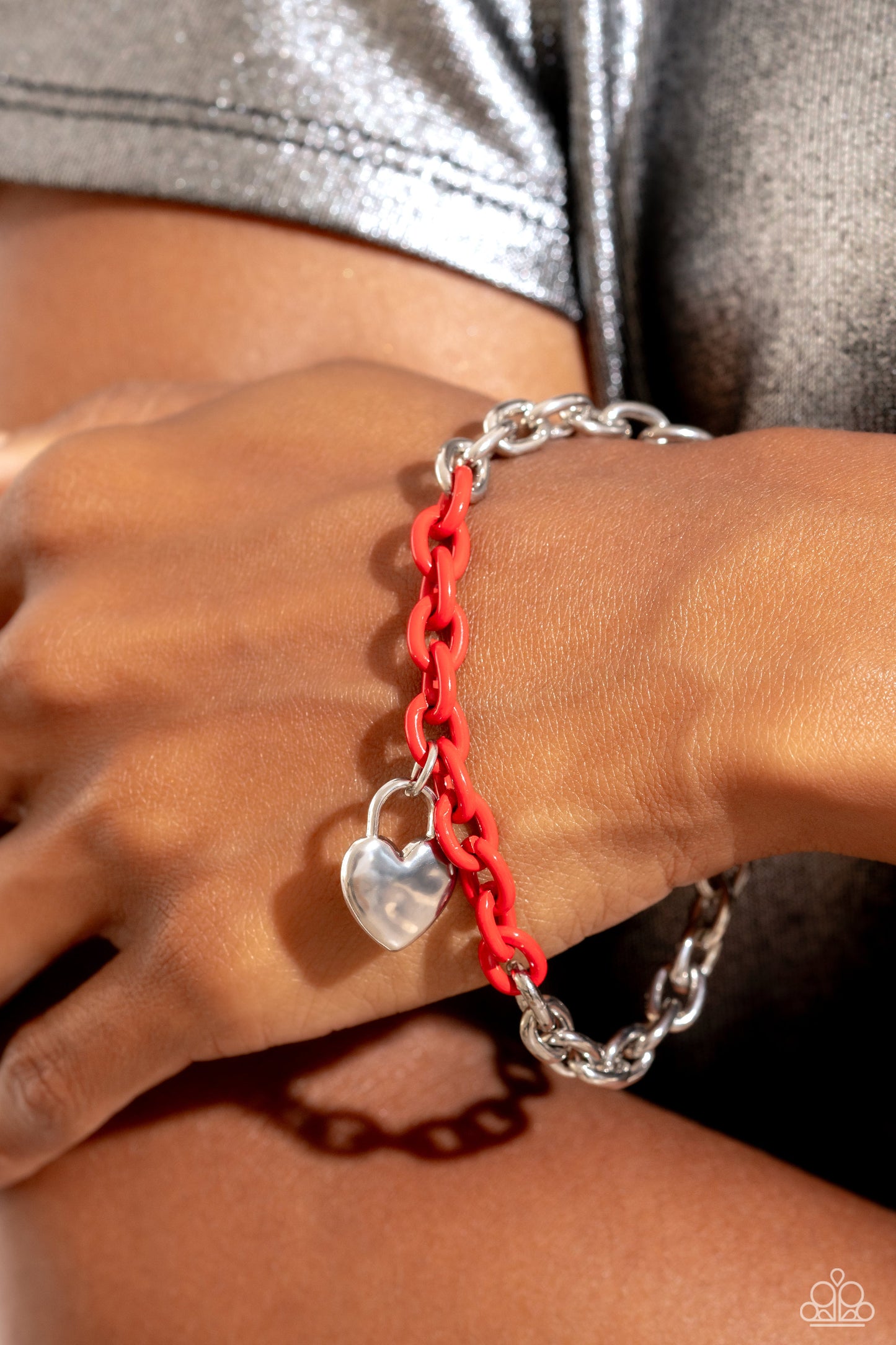 Locked and Loved Red Heart Toggle Bracelet - Paparazzi Accessories  Infused with splashes of red chain, a high-sheen silver chain dances around the wrist for a spunky industrial statement. A dainty hammered silver lock pendant graces the bottom of the bracelet, further infusing the design with a touch of romanticism. Features a toggle clasp closure.  Sold as one individual bracelet.  P9WH-RDXX-191PO