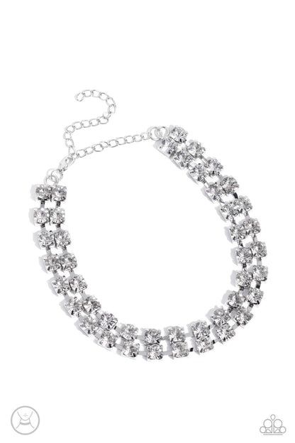 Glistening Gallery White Rhinestone Choker Necklace - Paparazzi Accessories  Featuring pronged silver fittings, strands of oversized, glittery white rhinestones connect with rows of silver box chains around the neck for a glittery twist. Features an adjustable clasp closure.  Sold as one individual choker necklace. Includes one pair of matching earrings.  P2CH-WTXX-070XX