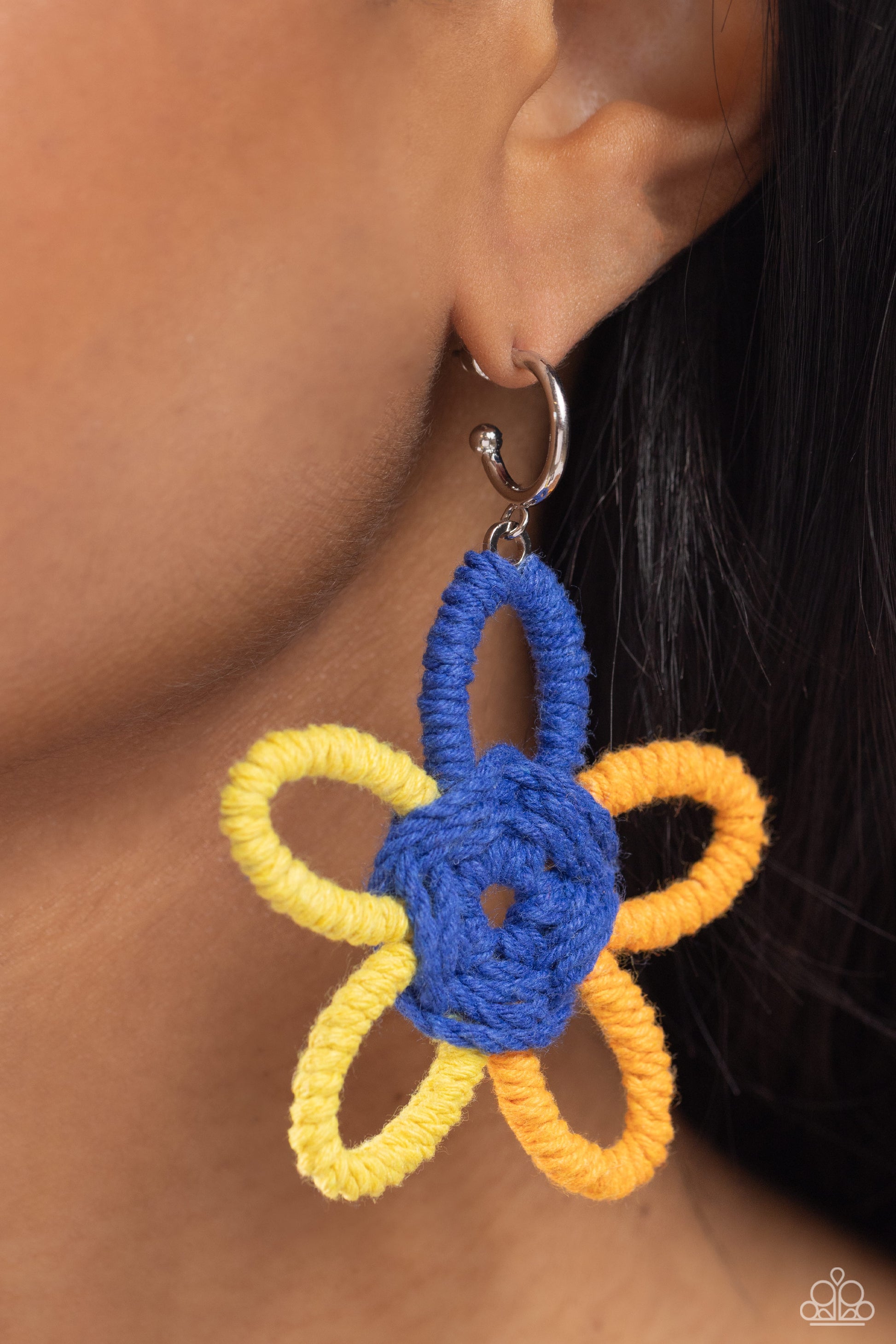 Spin a Yarn Orange Hoop Earring - Paparazzi Accessories  Featuring High Visibility, Persian Jewel, and orange yarn, an oversized flower swings freely from a dainty silver hoop, creating a playful lure. Earring attaches to a standard post fitting. Hoop measures approximately 1/2" in diameter.  Sold as one pair of hoop earrings.  P5HO-OGXX-015XX