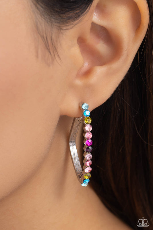Triangular Tapestry Multi Hoop Earring - Paparazzi Accessories  The front of a bold silver hoop is encrusted in multicolored rhinestones, creating a sparkly spectrum of color. The multicolored scalloped frame leisurely bends into an airy triangular frame for a geometric motif. Earring attaches to a standard post fitting. Hoop measures approximately 1/2" in diameter.  Sold as one pair of hoop earrings.  New Kit Sku:  P5HO-MTXX-090XX