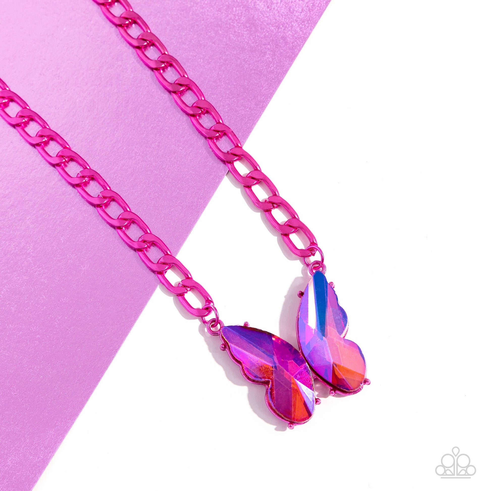 Fascinating Flyer Pink Butterfly Necklace - Paparazzi Accessories  Featuring a UV finish, a pair of oversized pink gem wings form into a pronged butterfly frame at the bottom of an electric pink curb chain for a vibrant, whimsical display. Features an adjustable clasp closure.  Sold as one individual necklace. Includes one pair of matching earrings.  P2ST-PKXX-161XX