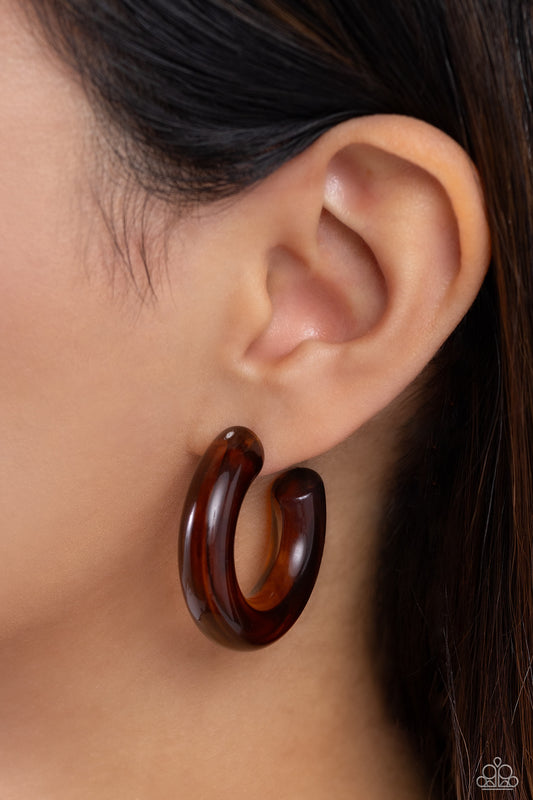 Glassy GAZE Brown Hoop Earring - Paparazzi Accessories  Thick, glossy brown acrylic frames snugly loop and curl just below the ear for a fashionable finish. Earring attaches to a standard post fitting. Hoop measures approximately 1 1/2" in diameter.  Sold as one pair of hoop earrings.  Sku:  P5HO-BNXX-017XX