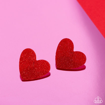 Sparkly Sweethearts Red Heart Post Earring - Paparazzi Accessories  Dusted in sparkles, a red acrylic flat heart frame shimmers and shines from the ear for a flirtatious finish. Earring attaches to a standard post fitting.  Sold as one pair of post earrings.  SKU: P5PO-RDXX-046XX