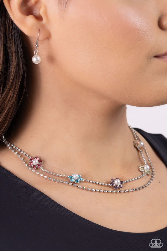 A SQUARE Beauty Multi Necklace - Paparazzi Accessories  Featuring silver square fittings, white rhinestones cascade into two layers below the collar adding glitzy movement to the sparkling centerpiece. Infused along the uppermost chain, a glitzy collection of pearl-dotted flowers with rose, blue, amethyst, yellow, and peachy rhinestone petals creates a splash of whimsical color. Features an adjustable clasp closure.