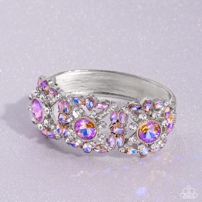 Shimmering Solo Orange Hinge Bracelet - Paparazzi Accessories  Various orange and white rhinestones in round, teardrop, and marquise cuts sparkle atop airy, silver frames, connected to a silver bangle-like bracelet around the wrist for a jaw-dropping dazzle. Features a hinged closure.  Sold as one individual bracelet.  SKU: P9RE-OGXX-067XX