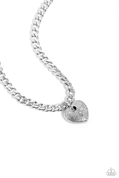 Ardent Affection White Heart Necklace - Paparazzi Accessories  Featuring an intense white rhinestone embellishment, an oversized silver heart frame swings from the bottom of a thick silver curb chain for an edgy declaration. Features an adjustable clasp closure.  Sold as one individual necklace. Includes one pair of matching earrings.  SKU: P2ST-WTXX-138XX  *LOP January 2024