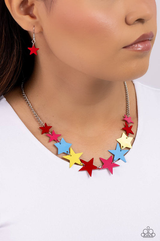 Starstruck Season Red Necklace - Paparazzi Accessories  Featuring various sizes, a collection of red, High Visibility, Poppy Red, and blue stars cascade around the neckline, on a classic silver chain creating an intense, starstruck statement. Features an adjustable clasp closure.  Sold as one individual necklace. Includes one pair of matching earrings.  P2ST-RDXX-128XX
