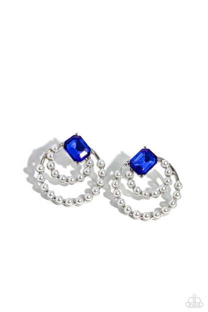 Double Standard Blue Post Earring - Paparazzi Accessories  Infused with dainty bubbly white pearls, a silver double hoop frame swings from a solitaire emerald-cut blue gem, haphazardly placed at the top of the joined hoops, creating a vintage display. Earring attaches to a standard post fitting.  Sold as one pair of post earrings.  P5PO-BLXX-163XX