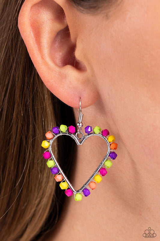 Fun-Loving Fashion Multi Heart Earring - Paparazzi Accessories  A vibrant collection of Rose Violet, Kohlrabi, purple, yellow, and coral seed beads are wrapped along the outside curve of a shiny, silver heart frame by shimmery silver wire for a handcrafted, fun-loving finish. Earring attaches to a standard fishhook fitting.  Sold as one pair of earrings.  P5WH-MTXX-199XX