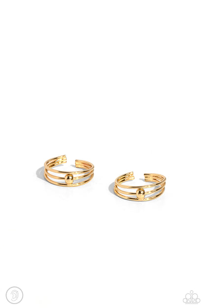 Stud Story Gold Cuff Earring - Paparazzi Accessories  A trio of thin, sleek gold bars arc around the ear to create a trendy, adjustable, one-size-fits-all cuff. A solitaire gold stud dots the center of the layered display for additional eye-catching detail.  Sold as one pair of cuff earrings.  P5PO-CFGD-260XX