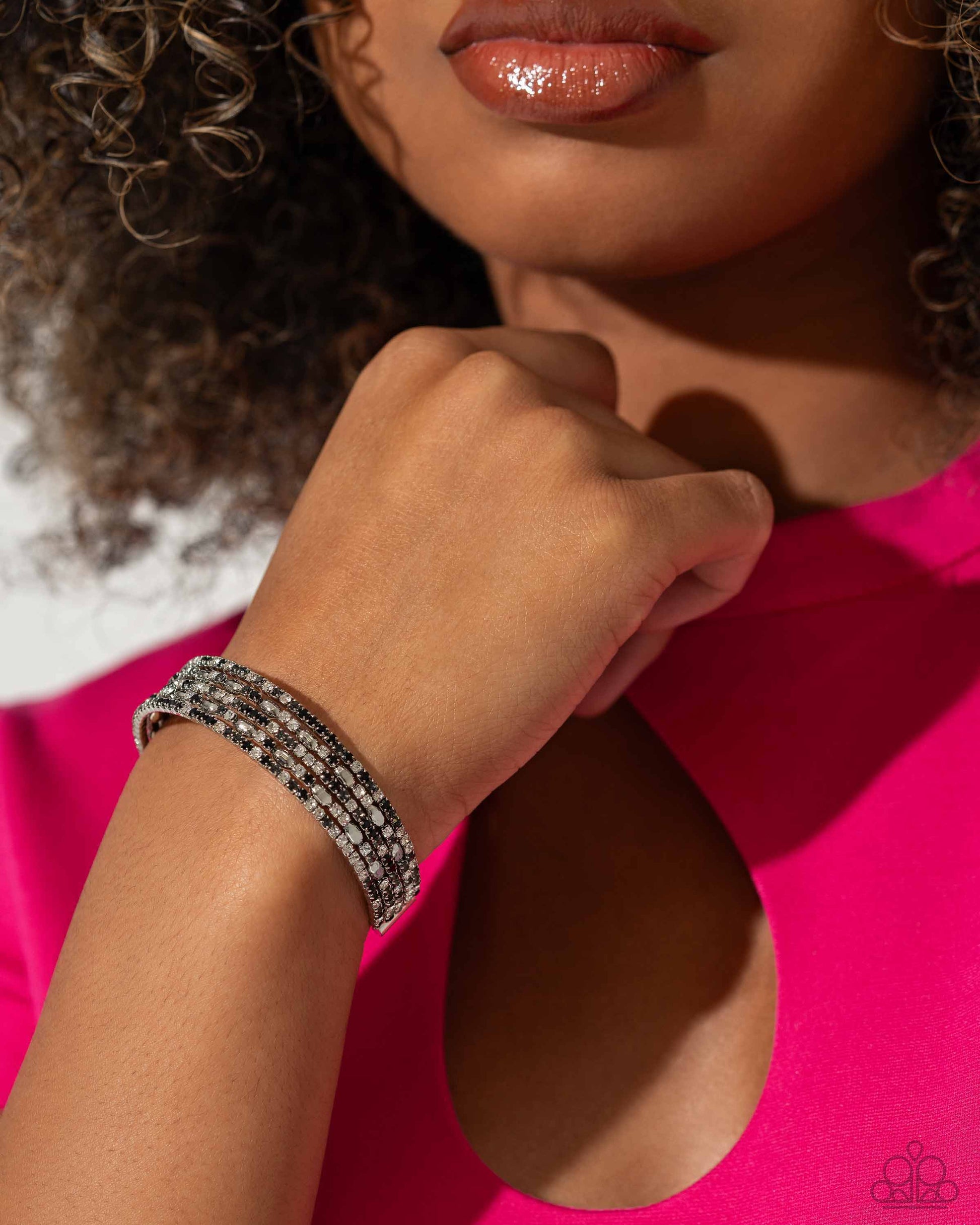 Endless Energy Black Cuff Bracelet - Paparazzi Accessories  Four strands of dazzling white, black, and smoky rhinestones flank shiny silver accents, coalescing into a sparkly layered cuff around the wrist.  Sold as one individual bracelet.  SKU: P9DA-BKXX-161XX