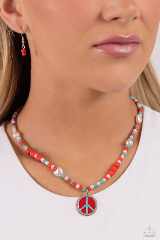 Pearly Possession Red Peace Necklace - Paparazzi Accessories  Infused along an invisible string, red, baby pink, and tiffany seed beads combine with sporadically placed red discs, and glossy white and heart-shaped pearls for a vibrant pop of color along the neckline. A silver peace sign featuring red and tiffany paint dangles from the colorful strand for a groovy finish. Features an adjustable clasp closure.  Sold as one individual necklace. Includes one pair of matching earrings.  P2DA-RDXX-105XX